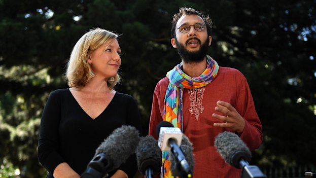 Jonathan Sri gained national attention when he stood beside resigning senator Larissa Waters in 2017, earning the moniker “Rainbow Scarf Man”.