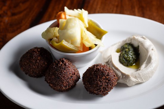 Falafel with tahini, pickles and zhoug.
