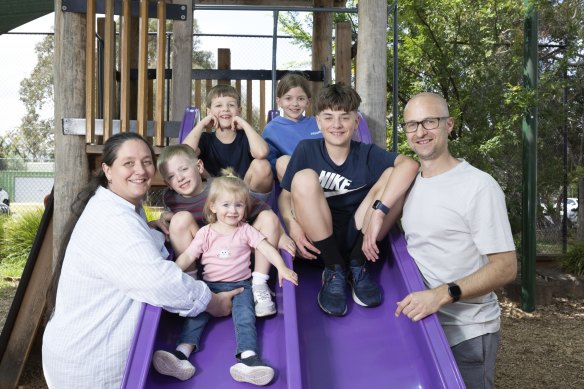 Amanda Murray-Alston, her husband Andrew George and their five children (from left): Benjamin, 6, Thomas, 8, Isabel, 10, and Oliver, 12, with 2-year-old Emilia in the foreground at their school, Ascot Vale Primary School . where they spend time after school and on weekends. 