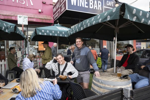 Bin 3 cafe and cellars owner Tom Mornement with customers on Friday afternoon. 