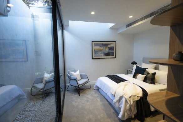 A courtyard and skylight brightens the main bedroom. 