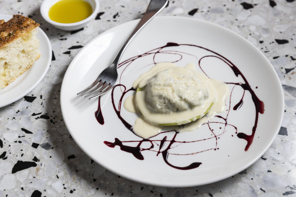 Hare raviolo with cheese sauce and a drizzle of chianti reduction.