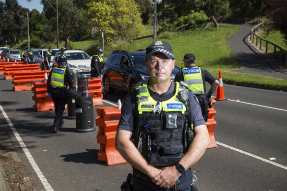 Leading Senior Constable Paul Gosling at the Upper Ferntree Gully vehicle checkpoint on Sunday, its last day of operation. 