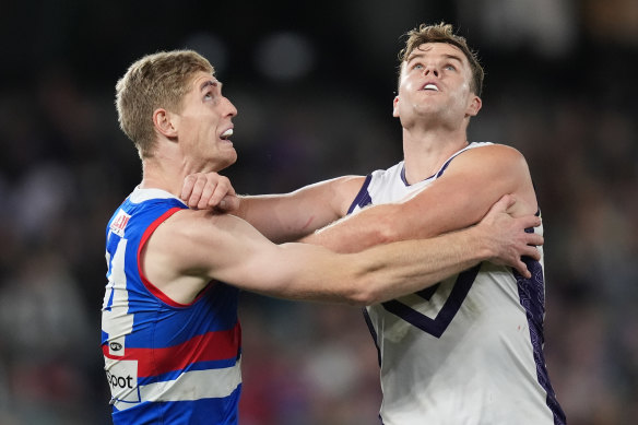 Sean Darcy of the Dockers makes contact with the throat of Tim English of the Bulldogs.