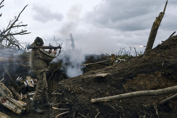 A Ukrainian soldier fires an RPG toward Russian positions at the frontline near Avdiivka, an eastern city where fierce battles against Russian forces have been taking place, in the Donetsk region.