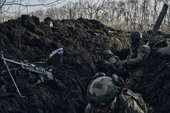 Ukrainian soldiers in a trench under Russian shelling on the frontline close to Bakhmut, Donetsk region, Ukraine.