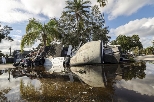 Discarded items from homes that filled with floodwater from Hurricane Helene in St Petersburg, Florida.