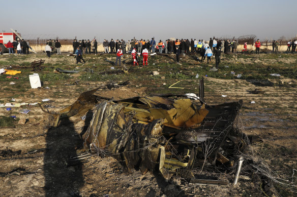 Debris is seen from a plane crash on the outskirts of Tehran, Iran on Wednesday, after a Ukrainian aircraft carrying 176 people crashed shortly after take-off from the city's main airport, killing all on board.