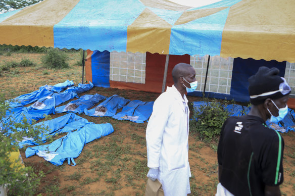 The exhumed bodies of victims of a religious cult are laid out in the village of Shakahola, near the coastal city of Malindi.