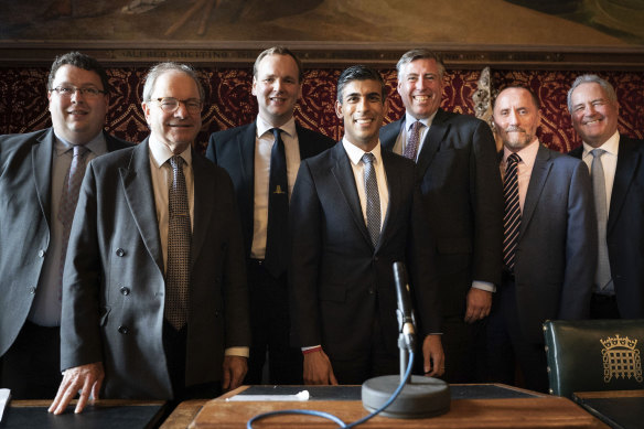 Rishi Sunak (centre) poses for a photo with members of the 1922 Committee.
