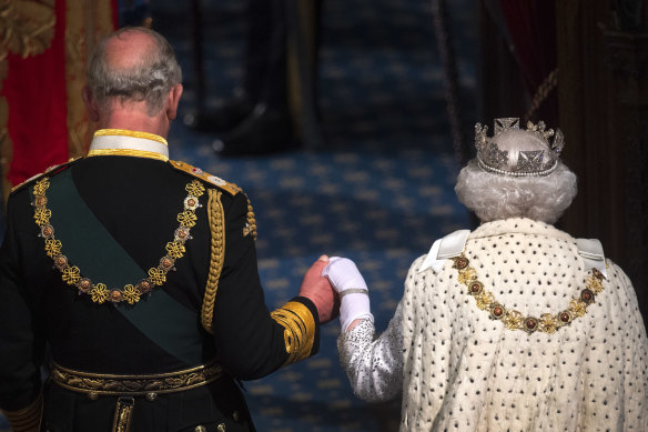 The Queen and Prince Charles attend the State Opening of Parliament.