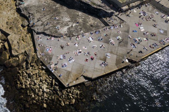 Sydneysiders soak up the sunshine at Clovelly in the eastern suburbs on Friday.