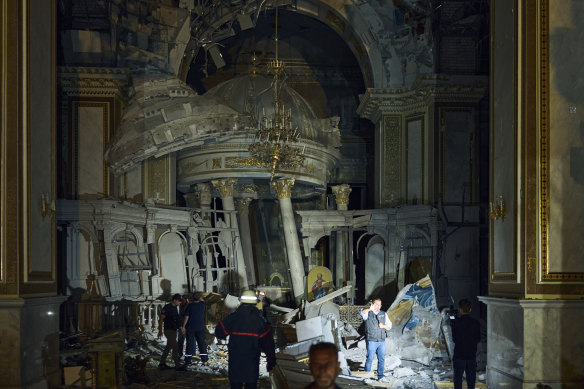 People walk inside the Odesa Transfiguration Cathedral, heavily damaged in a Russian missile attack in Odesa, Ukraine.