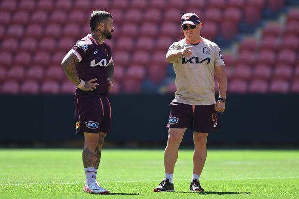 Kevin Walters and Adam Reynolds debrief at Broncos training.