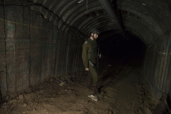 An Israeli soldier walks through the largest tunnel found in Gaza so far.