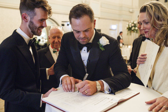 Celebrant Marney McQueen officiating the wedding of Fraser Stark and Michael Edwards at Sydney’s Queen Victoria Building in September. She even duetted with Stark.
