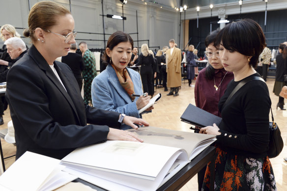Marina Afonina (left), of Albus Lumen, speaks to the judges at the final of the 2019 Woolmark Prize in London in February.