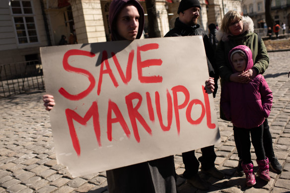Ukrainians in the western city of Lviv take part in an action in support of the residents and defenders of Mariupol.