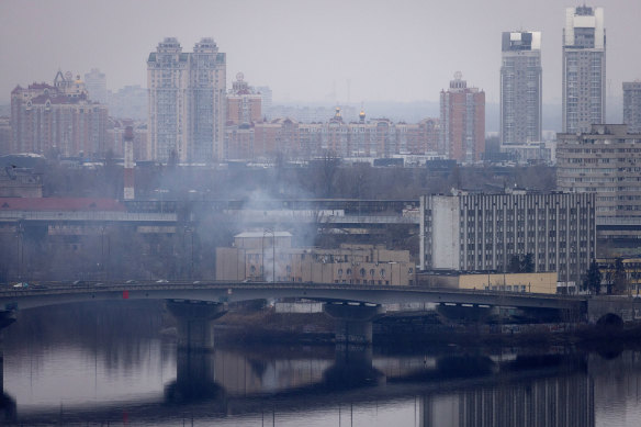 Smoke rises from outside an intelligence building in Kyiv, Ukraine, on February 24. 
