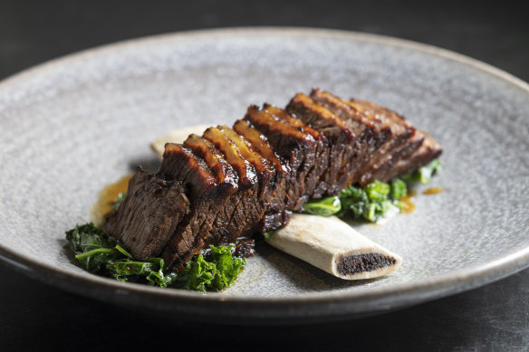 Beef short ribs with sauteed kale.