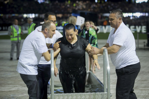Hundreds of people were baptised at Marvel Stadium.