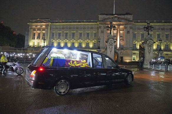 The hearse carrying Queen Elizabeth II’s coffin arrives at Buckingham Palace in London.