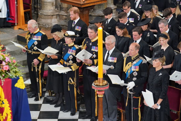 King Charles III, Camilla, Queen Consort, the Princess Royal and the rest of the royal family sit in front of the coffin.