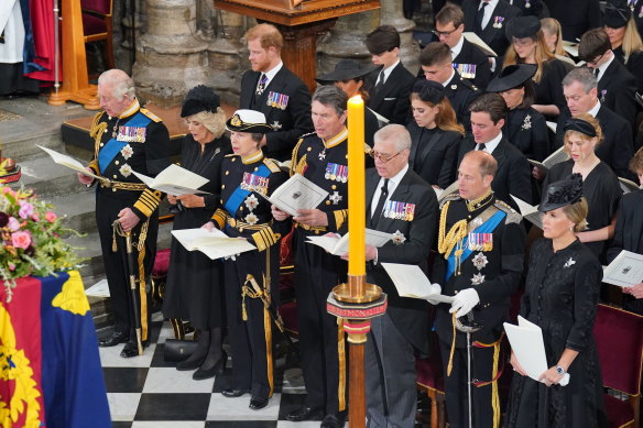 King Charles III, Camilla, Queen Consort, the Princess Royal and the rest of the royal family sit in front of the coffin. 

