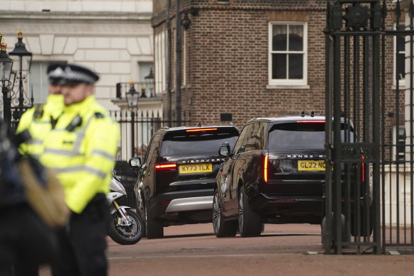 A convoy of cars believed to be carrying Prince Harry arrive at Clarence House on Tuesday.