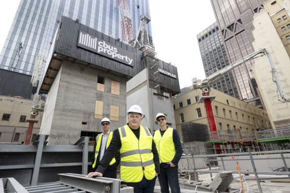 Cbus boss Adrian Pozzo, Chris Lucas and Bates Smart architect Cian Davis check the under-construction office tower at 435 Bourke Street, Melbourne.