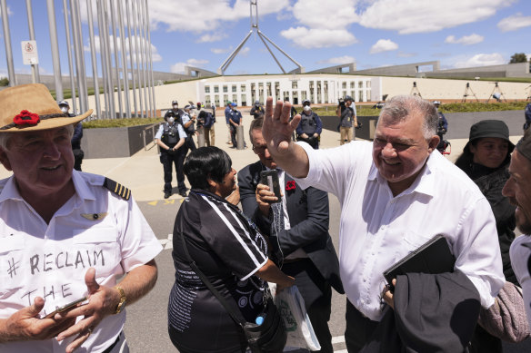 United Australia Party MP Craig Kelly with anti-vaccine mandate protesters outside Parliament in February.
