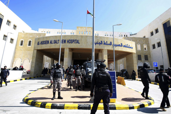 Soldiers stand guard outside Al-Hussein Al Salt Hospital in Salt, Jordan after at least six patients in a COVID-19 ward at the hospital near the capital Amman died due to a shortage of oxygen supplies. 
