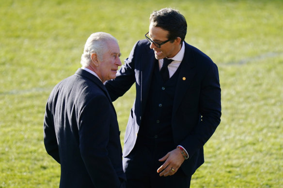 King Charles speaks with actor Ryan Reynolds during the visit. 