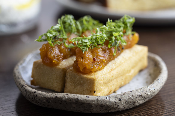 Panisse topped with spiced pumpkin relish.