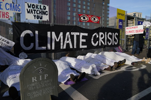 Climate activists stage a protest near the venue for the COP26 UN Climate Summit in Glasgow.