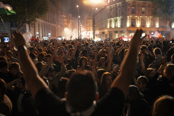 People gather at the Republique Plaza in Paris after the second round of the legislative election, 