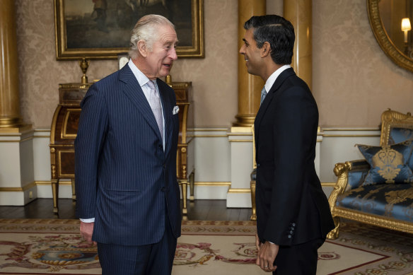 The King greets Rishi Sunak at Buckingham Palace to invite him to form a new government.
