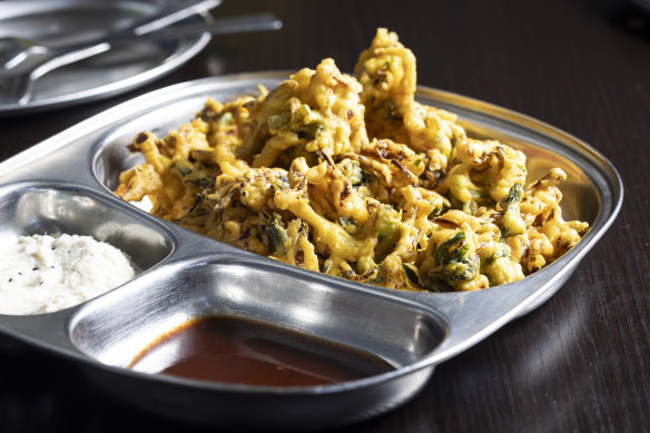 Vegetable pakoda fritters with chutney.