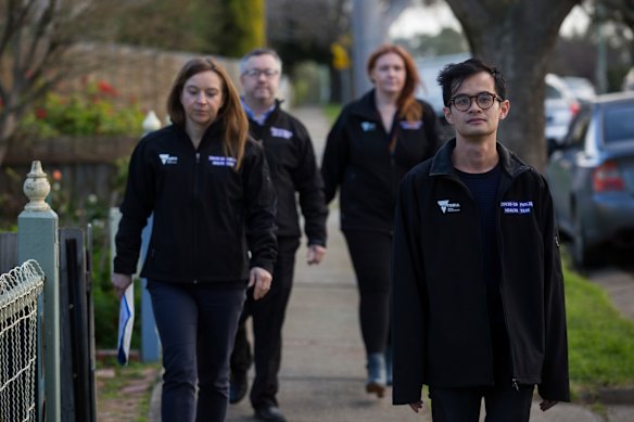 Joey Nguyen (right), a paediatrician  at the Royal Children's Hospital, is one of what will become hundreds of doorknockers.