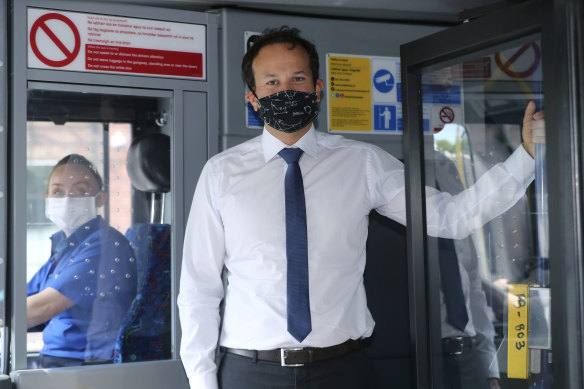 Irish PM Leo Varadkar encourages passengers on a Dublin bus to wear a face mask as some coronavirus lockdown measures were eased.