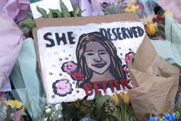 A drawing of Sarah Everard is placed with floral tributes and candles at the bandstand on Clapham Common, London, near where she was killed.