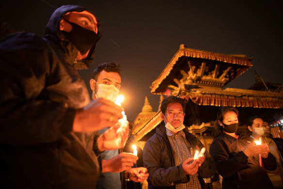 Candlelit vigils for Myanmar’s dead have been held across the country and internationally, including this one on March 31 in Kathmandu, Nepal. 