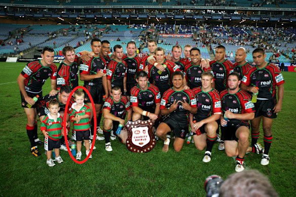 Sam Walker (circled) next to dad Ben and brother Jackson at the 2006 Charity Shield match.