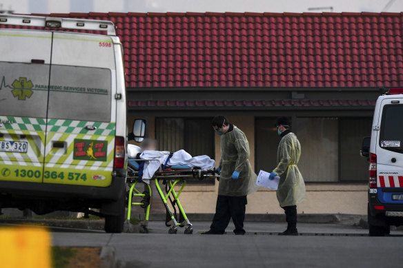 A patient is removed from St Basil's Homes for the Aged in the Melbourne suburb of Fawkner on July 25.