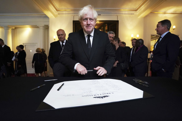 Former British prime minister Boris Johnson signs the Proclamation of Accession of King Charles III following the Accession Council ceremony at St James’s Palace, London in September.