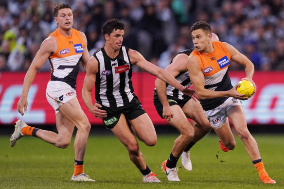 Scott Pendlebury (left) chases Josh Kelly in Collingwood's preliminary final loss to GWS. 