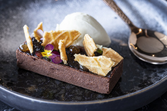 Chocolate tart shell filled with  cherry compote and served with gorgonzola ice-cream.