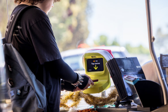 Cayden Costantino uses his iPhone to touch onto the new myki system on Wangaratta’s bus network.
