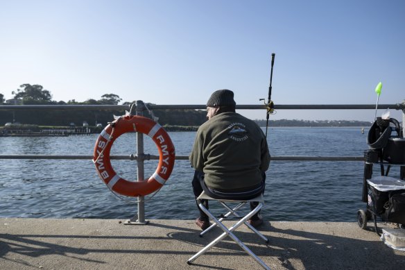 A fisherman at Beaumaris. 