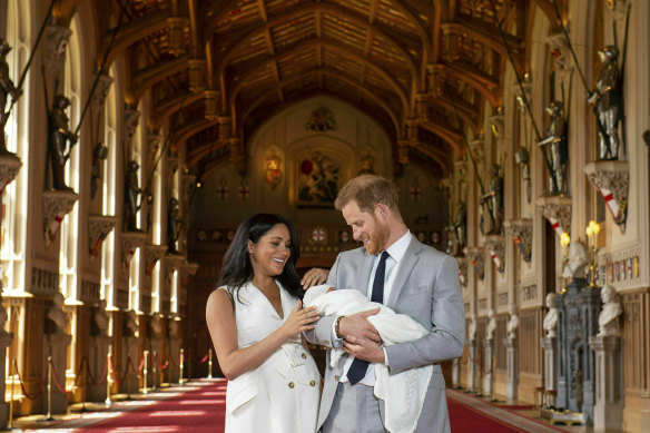 Meghan and Prince Harry pictured with their newborn son in St George's Hall at Windsor Castle in May 2019.
